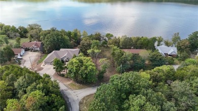 Lakefront living awaits! This .6-acre homesite offers the on Holiday Island Executive Golf Course in Arkansas - for sale on GolfHomes.com, golf home, golf lot