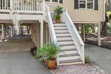 Nestled beneath the island's moss-draped live oaks and palms on The Seabrook Island Club in South Carolina - for sale on GolfHomes.com, golf home, golf lot