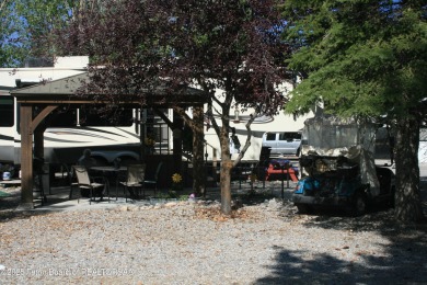 Extra large corner lot, with mature trees.  2021 36 foot Grand on Star Valley RV Golf Course in Wyoming - for sale on GolfHomes.com, golf home, golf lot