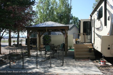Extra large corner lot, with mature trees.  2021 36 foot Grand on Star Valley RV Golf Course in Wyoming - for sale on GolfHomes.com, golf home, golf lot