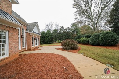 Classic elegance and Southern tradition are the hallmarks of on Jennings Mill Country Club in Georgia - for sale on GolfHomes.com, golf home, golf lot