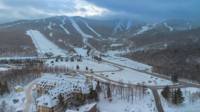 This spacious, corner unit has beautiful views of the abutting on Killington Golf Course in Vermont - for sale on GolfHomes.com, golf home, golf lot