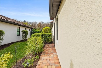 This IMMACULATE KENDRICK VILLA offers a peaceful PRESERVE VIEW on Panther Run Golf Club in Florida - for sale on GolfHomes.com, golf home, golf lot