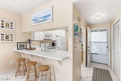 Stunning panoramic views of the golf course, lakes with lighted on Golfview Golf and Racquet Club in Florida - for sale on GolfHomes.com, golf home, golf lot