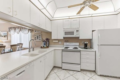 Stunning panoramic views of the golf course, lakes with lighted on Golfview Golf and Racquet Club in Florida - for sale on GolfHomes.com, golf home, golf lot