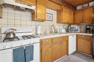 Tucked beneath majestic oaks and pines, this 3 bedroom, 2 bath on Big Bear Mountain Ski and Golf Resort in California - for sale on GolfHomes.com, golf home, golf lot