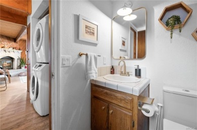 Tucked beneath majestic oaks and pines, this 3 bedroom, 2 bath on Big Bear Mountain Ski and Golf Resort in California - for sale on GolfHomes.com, golf home, golf lot