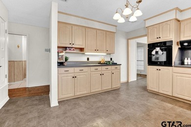 This comfortable home is nestled back in the pine trees on a on Hide-A-Way Lake Golf Course in Texas - for sale on GolfHomes.com, golf home, golf lot