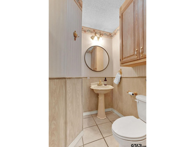 This comfortable home is nestled back in the pine trees on a on Hide-A-Way Lake Golf Course in Texas - for sale on GolfHomes.com, golf home, golf lot