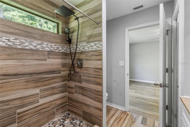 Welcome to this beautifully updated 3-bedroom, 2-bathroom home on Turkey Creek Golf and Country Club in Florida - for sale on GolfHomes.com, golf home, golf lot