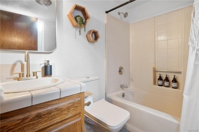 Tucked beneath majestic oaks and pines, this 3 bedroom, 2 bath on Big Bear Mountain Ski and Golf Resort in California - for sale on GolfHomes.com, golf home, golf lot