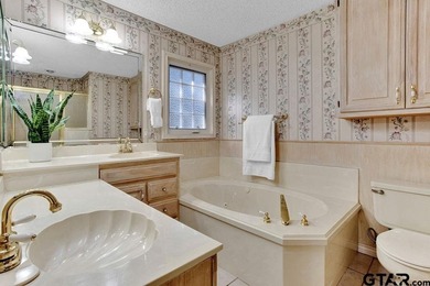 This comfortable home is nestled back in the pine trees on a on Hide-A-Way Lake Golf Course in Texas - for sale on GolfHomes.com, golf home, golf lot