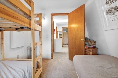 Tucked beneath majestic oaks and pines, this 3 bedroom, 2 bath on Big Bear Mountain Ski and Golf Resort in California - for sale on GolfHomes.com, golf home, golf lot