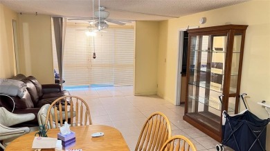 Golf, indoor and outdoor pools, tennis, movies and pickleball on Sunrise Lakes Phase III in Florida - for sale on GolfHomes.com, golf home, golf lot