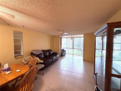 Golf, indoor and outdoor pools, tennis, movies and pickleball on Sunrise Lakes Phase III in Florida - for sale on GolfHomes.com, golf home, golf lot