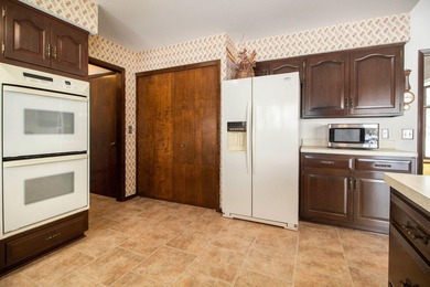 Sprawling brick ranch on a quiet culdesac overlooking the #11 on Travis Pointe Country Club in Michigan - for sale on GolfHomes.com, golf home, golf lot