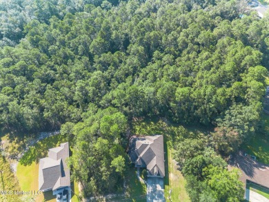 This house comes with a REDUCED RATE as low as 5.5% (APR 5 on Diamondhead Country Club in Mississippi - for sale on GolfHomes.com, golf home, golf lot