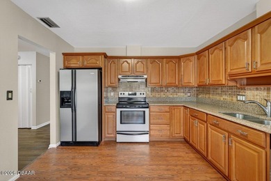 Tucked inside one of New Smyrna Beach's most peaceful golf-side on Hidden Lakes Golf Club in Florida - for sale on GolfHomes.com, golf home, golf lot