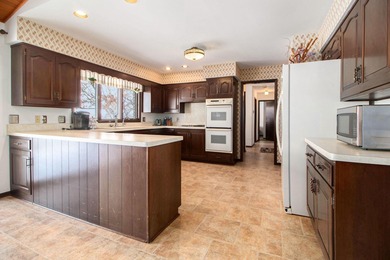 Sprawling brick ranch on a quiet culdesac overlooking the #11 on Travis Pointe Country Club in Michigan - for sale on GolfHomes.com, golf home, golf lot