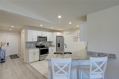 Easy Life. Lasting Style. Nearly new concrete block home in a on Spanish Lakes Country Club in Florida - for sale on GolfHomes.com, golf home, golf lot