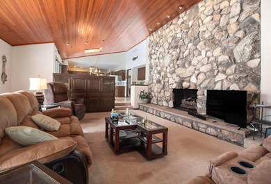 Sprawling brick ranch on a quiet culdesac overlooking the #11 on Travis Pointe Country Club in Michigan - for sale on GolfHomes.com, golf home, golf lot