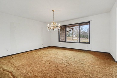 Situated on the prestigious Travis Pointe Golf Course on the on Travis Pointe Country Club in Michigan - for sale on GolfHomes.com, golf home, golf lot