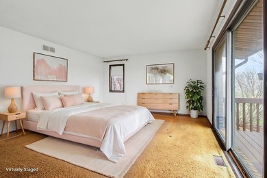 Situated on the prestigious Travis Pointe Golf Course on the on Travis Pointe Country Club in Michigan - for sale on GolfHomes.com, golf home, golf lot