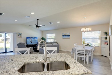 Easy Life. Lasting Style. Nearly new concrete block home in a on Spanish Lakes Country Club in Florida - for sale on GolfHomes.com, golf home, golf lot