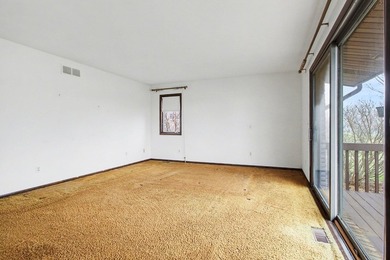 Situated on the prestigious Travis Pointe Golf Course on the on Travis Pointe Country Club in Michigan - for sale on GolfHomes.com, golf home, golf lot