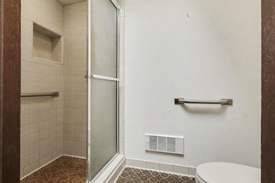 Situated on the prestigious Travis Pointe Golf Course on the on Travis Pointe Country Club in Michigan - for sale on GolfHomes.com, golf home, golf lot