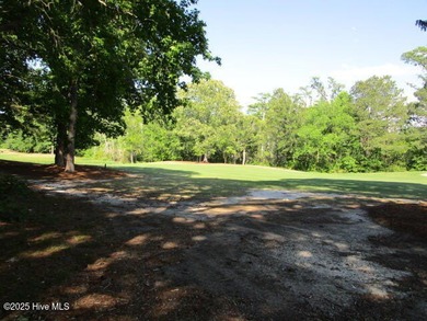 This .44 acre lot located on the golf course with trees in on Sound Golf Links at Albemarle Plantation in North Carolina - for sale on GolfHomes.com, golf home, golf lot