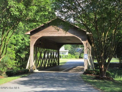 This lot is located in Albemarle Plantation at the 5th green and on Sound Golf Links at Albemarle Plantation in North Carolina - for sale on GolfHomes.com, golf home, golf lot