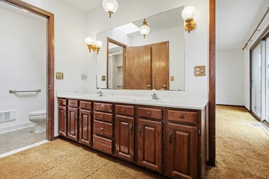 Situated on the prestigious Travis Pointe Golf Course on the on Travis Pointe Country Club in Michigan - for sale on GolfHomes.com, golf home, golf lot