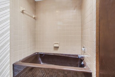 Situated on the prestigious Travis Pointe Golf Course on the on Travis Pointe Country Club in Michigan - for sale on GolfHomes.com, golf home, golf lot