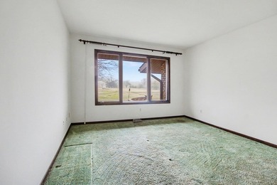 Situated on the prestigious Travis Pointe Golf Course on the on Travis Pointe Country Club in Michigan - for sale on GolfHomes.com, golf home, golf lot