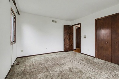 Situated on the prestigious Travis Pointe Golf Course on the on Travis Pointe Country Club in Michigan - for sale on GolfHomes.com, golf home, golf lot