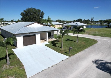 Easy Life. Lasting Style. Nearly new concrete block home in a on Spanish Lakes Country Club in Florida - for sale on GolfHomes.com, golf home, golf lot
