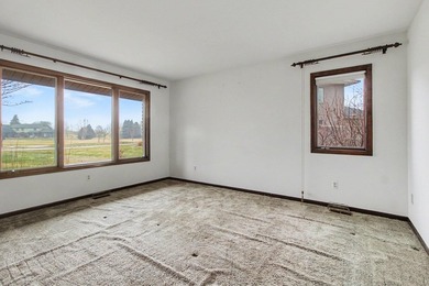 Situated on the prestigious Travis Pointe Golf Course on the on Travis Pointe Country Club in Michigan - for sale on GolfHomes.com, golf home, golf lot