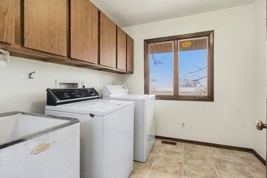 Situated on the prestigious Travis Pointe Golf Course on the on Travis Pointe Country Club in Michigan - for sale on GolfHomes.com, golf home, golf lot