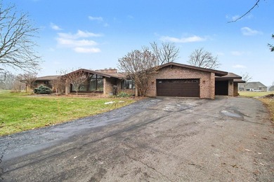 Situated on the prestigious Travis Pointe Golf Course on the on Travis Pointe Country Club in Michigan - for sale on GolfHomes.com, golf home, golf lot