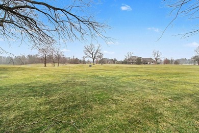 Situated on the prestigious Travis Pointe Golf Course on the on Travis Pointe Country Club in Michigan - for sale on GolfHomes.com, golf home, golf lot