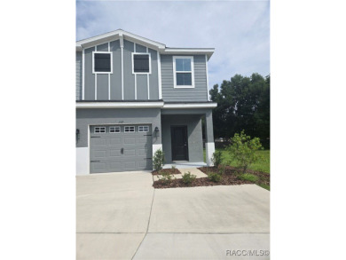 THE BLUE HERON TOWNHOUSE - Located in * The Premier Lakeside on Inverness Golf and Country Club in Florida - for sale on GolfHomes.com, golf home, golf lot