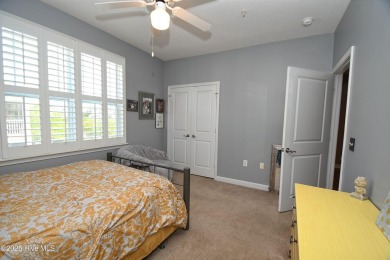 Pretty 3-bedroom top floor end unit with lots of upgrades and on Crow Creek Golf Club in North Carolina - for sale on GolfHomes.com, golf home, golf lot
