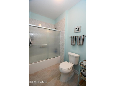 Pretty 3-bedroom top floor end unit with lots of upgrades and on Crow Creek Golf Club in North Carolina - for sale on GolfHomes.com, golf home, golf lot