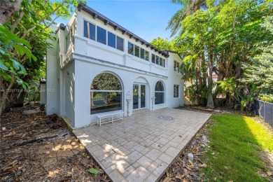 TWO STORY HOME ON THE LA GORCE COUNTRY CLUB GOLF COURSE IN THE on La Gorce Country Club in Florida - for sale on GolfHomes.com, golf home, golf lot