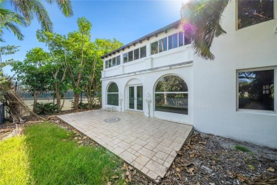 TWO STORY HOME ON THE LA GORCE COUNTRY CLUB GOLF COURSE IN THE on La Gorce Country Club in Florida - for sale on GolfHomes.com, golf home, golf lot