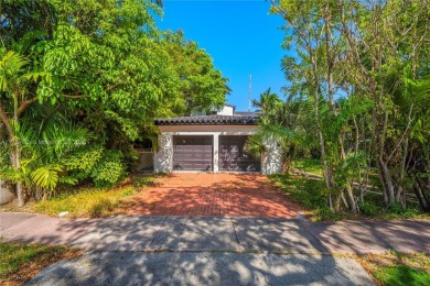 TWO STORY HOME ON THE LA GORCE COUNTRY CLUB GOLF COURSE IN THE on La Gorce Country Club in Florida - for sale on GolfHomes.com, golf home, golf lot