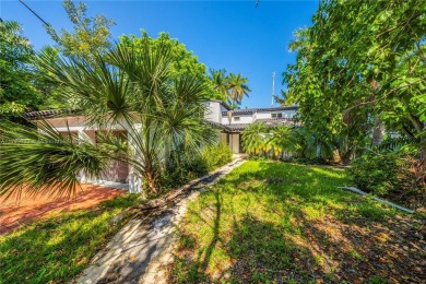 TWO STORY HOME ON THE LA GORCE COUNTRY CLUB GOLF COURSE IN THE on La Gorce Country Club in Florida - for sale on GolfHomes.com, golf home, golf lot