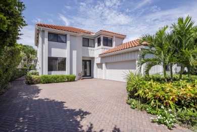 Serene water views frame this totally remodeled and well on Frenchmans Creek Country Club in Florida - for sale on GolfHomes.com, golf home, golf lot