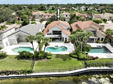 Serene water views frame this totally remodeled and well on Frenchmans Creek Country Club in Florida - for sale on GolfHomes.com, golf home, golf lot